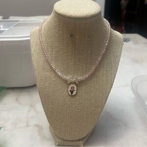 #14. Handmade Pink Beaded Necklace with Floral Pendant
